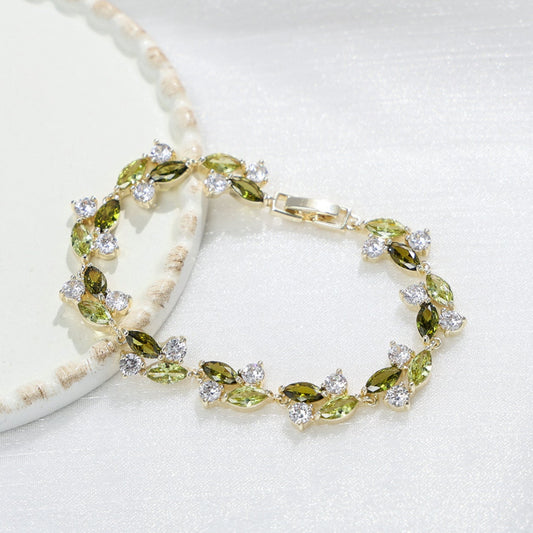 Emerald Whisper Leaf Bracelet – Green & White Zirconia Elegance in Gold Plated Copper