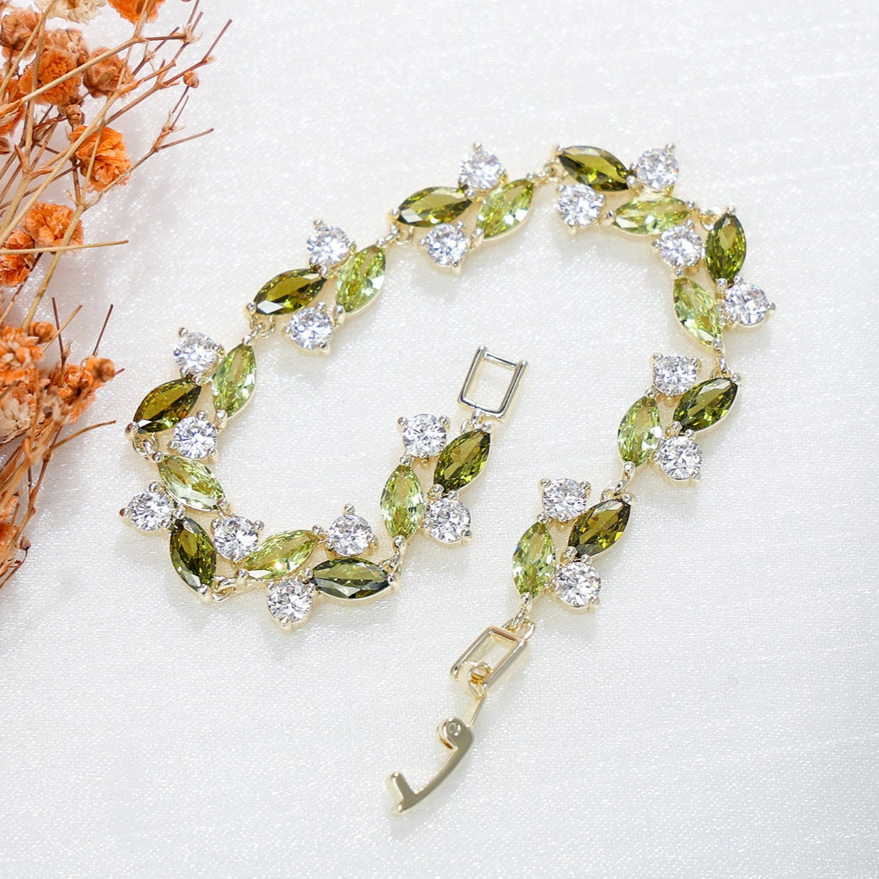 Emerald Whisper Leaf Bracelet – Green & White Zirconia Elegance in Gold Plated Copper